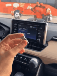 Wireless Car Play adapter by My Store, showing a sleek device connected in a car dashboard setup.